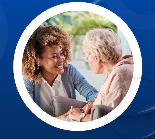 smiling seated clinician facing facing seated patient